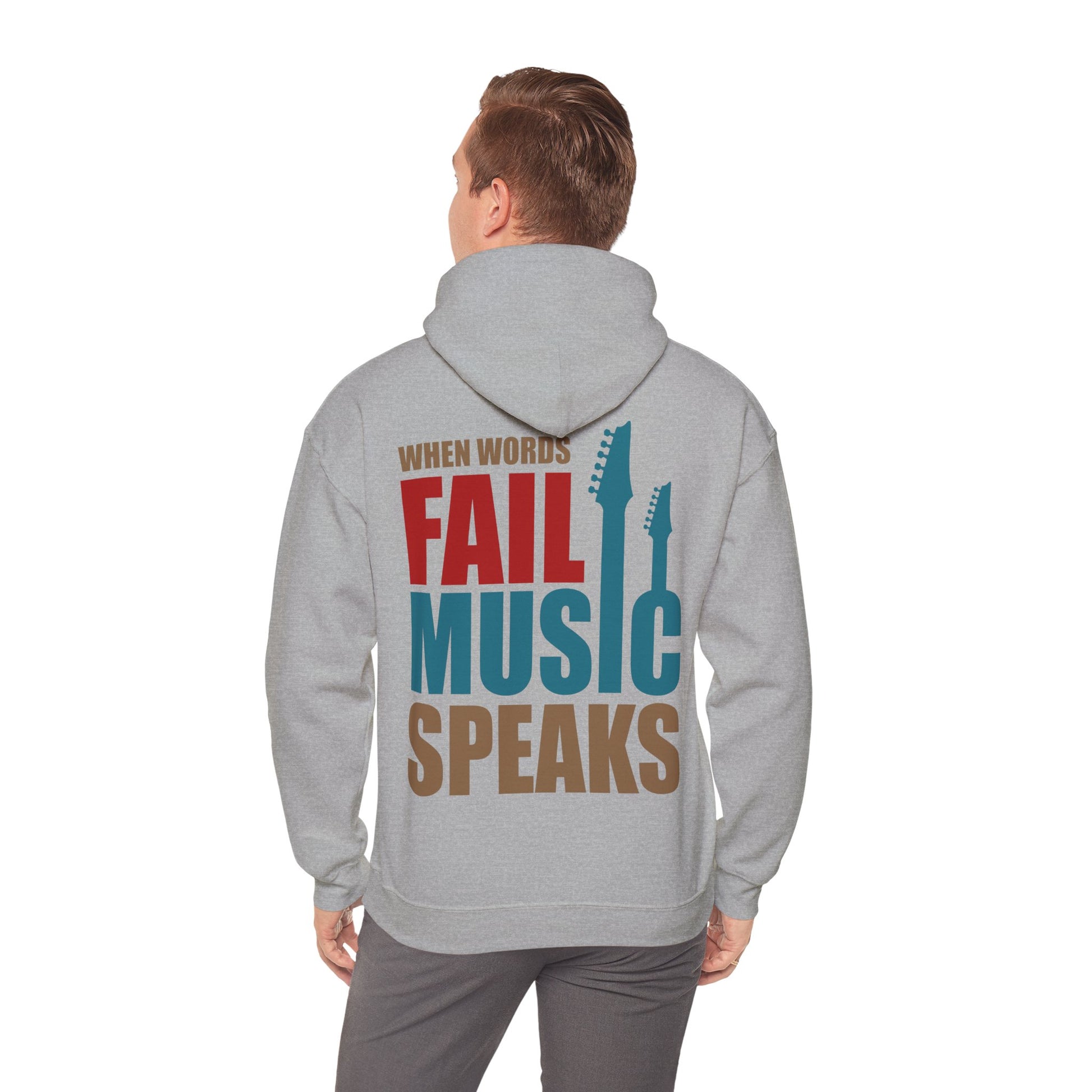 Model wearing a light grey hoodie with the powerful phrase 'When Words Fail Music Speaks' elegantly printed on the back, embodying style and passion for music.