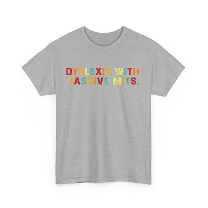 Front view of the vibrant 'DYSLEXIC WITH TASSIVE MITS' unisex cotton tee, featuring an eye-catching rainbow-text graphic on a soft grey background.