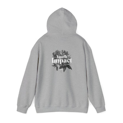 Contemporary grey hoodie featuring a striking back print of florals and bold typography, embodying a message of positivity.