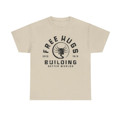 Stylish beige men's t-shirt with a vintage-inspired graphic design featuring 'FREE HUGS' and 'BUILDING BETTER WORLDS' in distressed text, combining comfort with contemporary fashion.