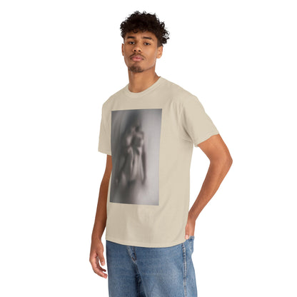 Contemporary beige graphic t-shirt adorned with a soft-focus image of a figure, modelled by a young man in casual denim, exuding a chic urban aesthetic.