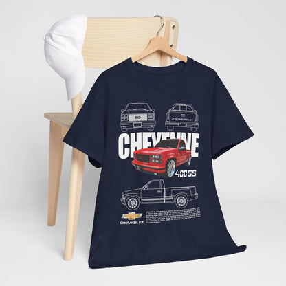 Chic Chevrolet Cheyenne T-shirt elegantly draped over a minimalist chair, complemented by a crisp white cap, embodying a sophisticated automotive lifestyle.
