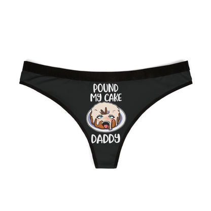 Luxurious black women's thong featuring a humorous graphic of a frosted cake with the playful phrase 'POUND MY CAKE DADDY' inscribed above, ideal for adding a cheeky touch to intimate celebrations.