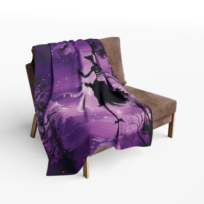 Decorative and Warm Halloween Spooky Arctic Fleece Blanket draped elegantly over a stylish armchair, featuring captivating Halloween-themed artwork, ideal for cozy movie nights.
