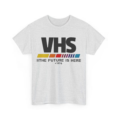 VHS Retro Logo Graphic Tee for Unisex | Soft Cotton, Nostalgic Design, Classic Fit - Front view showcasing a stylish grey t-shirt featuring a vibrant VHS logo with the phrase 'THE FUTURE IS HERE'.