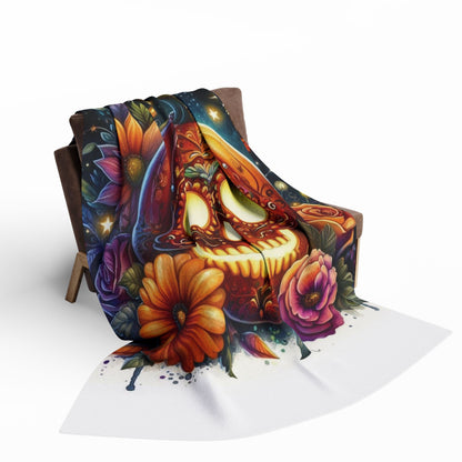 Luxurious Decorative and Warm Halloween Skellington Spooky Arctic Fleece Blanket draped over a chair, featuring vibrant designs of a festive skull surrounded by floral accents, perfect for adding a touch of elegance to your Halloween decor.