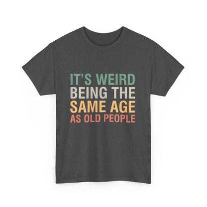 Striking front view of a premium urban unisex cotton T-shirt proudly displaying the whimsical saying 'It’s Weird Being The Same Age As Old People'.