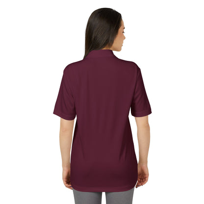 Back view of a model showcasing the Adidas Unisex Performance Polo Shirt in burgundy, designed for elegance and eco-conscious living.