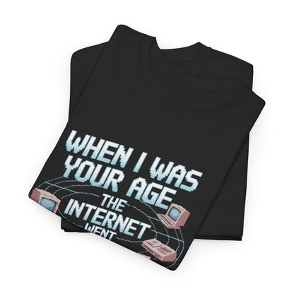 Stylish graphic t-shirt featuring the phrase 'When I Was Your Age the Internet Went' surrounded by retro computer designs, perfect for nostalgia lovers.