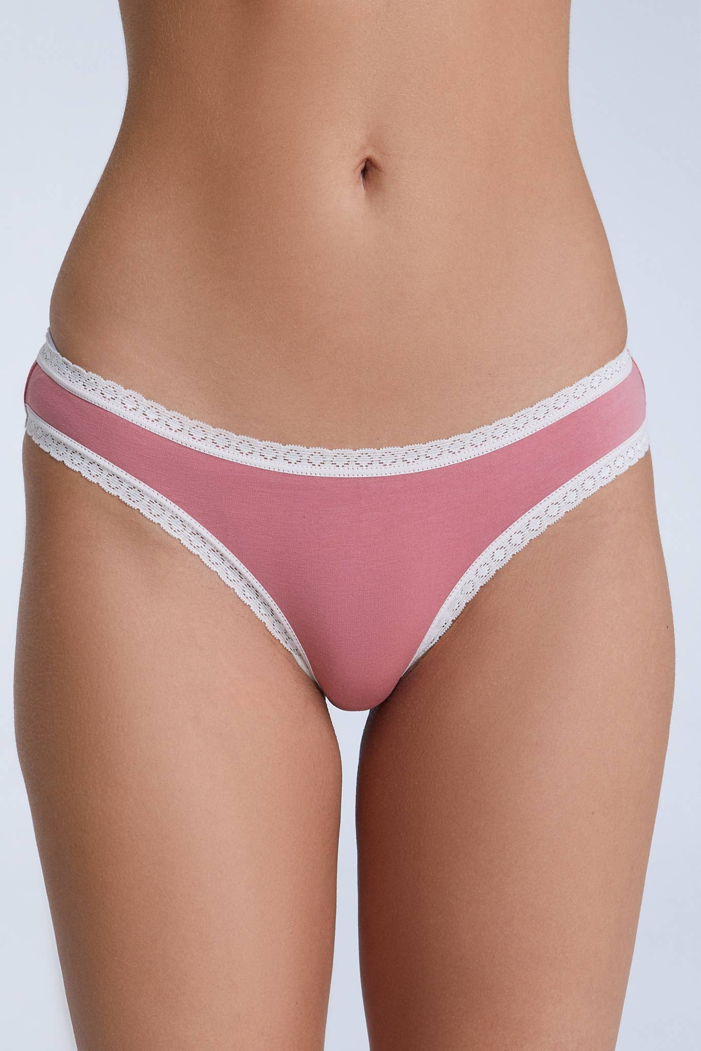 Close-up of eco-friendly organic cotton briefs showcasing the intricate lace detailing and soft fabric.