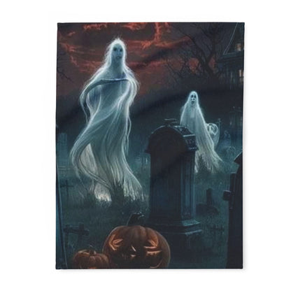 Luxurious Decorative and Warm Halloween Spooky Arctic Fleece Blanket featuring ghostly apparitions in a graveyard scene, ideal for cozy autumn nights.