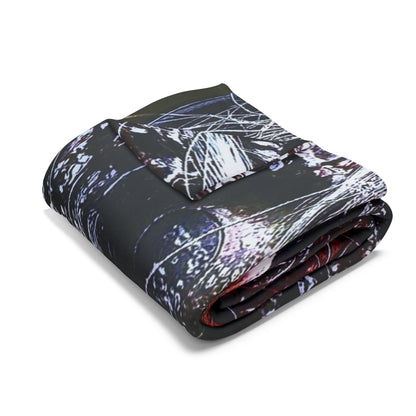 Exquisite Decorative and Warm Halloween Spooky Arctic Fleece Blanket neatly folded, highlighting its luxurious texture and vibrant Halloween designs.