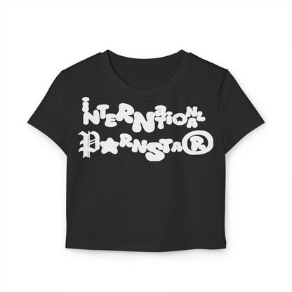 Elegant black cropped baby T-shirt displaying a whimsical graphic with the words 'International P a r n star', perfect for a stylish statement look.