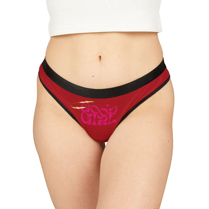 Luxurious red 'Good Girl' thong panties showcased on a model, featuring a playful design with a stylish pink logo and black waistband, epitomising charm and sophistication.