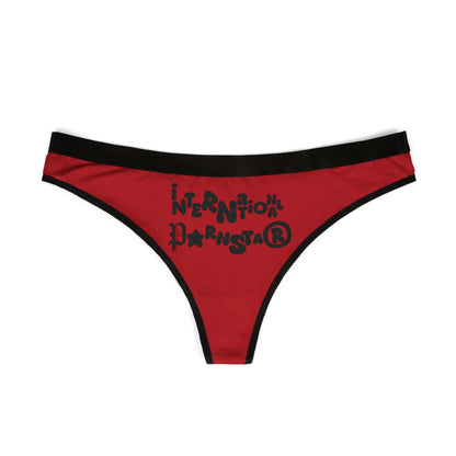 Elegant red thong underwear for women, accentuated with playful and bold black lettering stating 'International Pornstar'. This statement piece combines comfort and style, ideal for those who embrace confidence and allure.