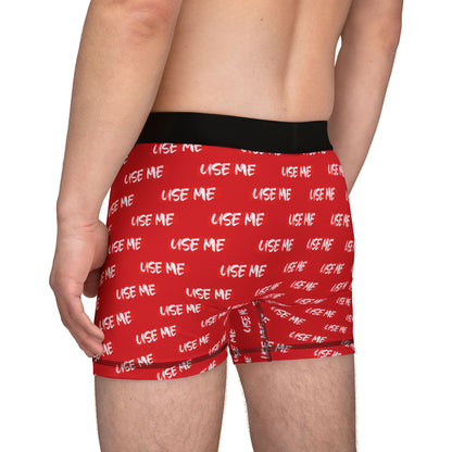 Luxurious red men's boxer briefs featuring a playful 'USE ME' print, ideal for romantic occasions such as Valentine's Day or anniversaries. Designed for comfort and style, these cheeky undergarments blend flirtation with quality craftsmanship.