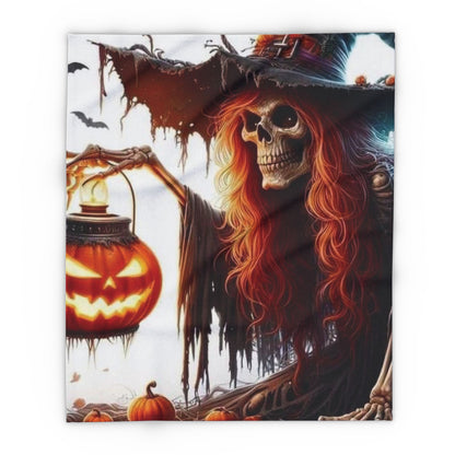 Elegant Decorative and Warm Halloween Spooky Arctic Fleece Blanket showcasing an artistic design of a skull witch illuminated by a glowing pumpkin, ideal for cozy autumn nights.