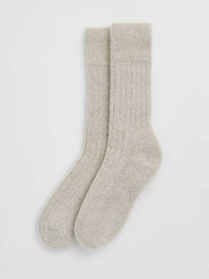 Luxurious ultra soft alpaca ribbed bed socks with cushioned sole, showcasing delicate ribbed texture and premium quality craftsmanship.
