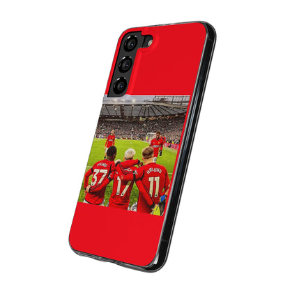 Manchester United Mainoo Garnach Hojlund Soft Phone Case featuring players celebrating on the pitch, ideal for soccer fans seeking a touch of elegance.