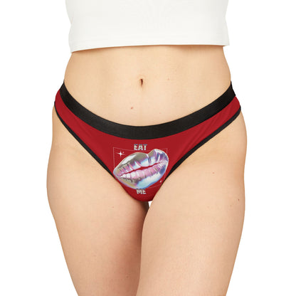 Stylish 'Eat ME' thong featuring glossy lips design on a vibrant red background, embodying luxury lingerie aesthetics.