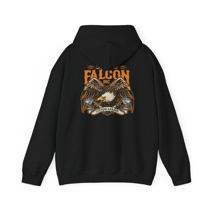Luxurious black hoodie featuring an intricate eagle graphic with engine pistons, showcasing the dynamic branding 'FALCON INC.' and 'CUSTOM GARAGE' for a bold, powerful style.