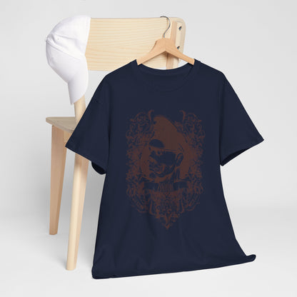 Stylish Men's Zombie Graphic T-Shirt showcased alongside a white cap on a wooden chair. The bold navy shirt features a detailed brown zombie graphic embedded in decorative baroque artistry, perfect for trendsetters.