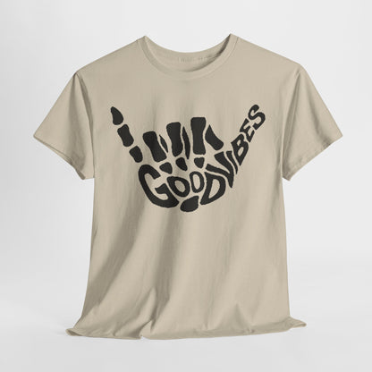 Casual cream t-shirt displayed at an angle, prominently featuring an artistic black skeletal hand gesture and the phrase 'Good Vibes', a must-have for trendsetters.