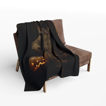 Sophisticated view of the Decorative and Warm Halloween Spooky Arctic Fleece Blanket draped over a chic sofa, showcasing its intricate Halloween-themed artwork.
