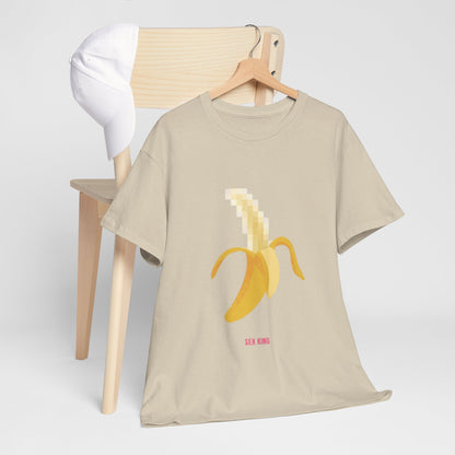 Luxurious 'Pixelated Banana' graphic t-shirt styled elegantly on a wooden hanger with a baseball cap, showcasing the whimsical design and vibrant colours.