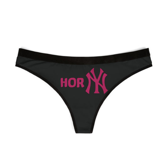 Sleek black thong laid flat, showcasing eye-catching 'Horny' print alongside a stylised New York Yankees logo, a statement piece for the daring woman.