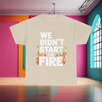 Chic We Didn’t Start the Fire Graphic T-Shirt in soft beige, adorned with eye-catching lettering and flame accents, a symbol of contemporary fashion.