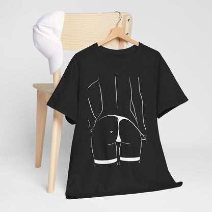 Contemporary black T-shirt featuring a striking white line design, styled with a cap on a wooden chair, reflecting casual chic artistry.