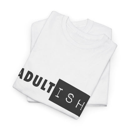 Elegant stacked t-shirts revealing the 'Adult-ish' graphic design, showcasing the playful spirit of adulthood.
