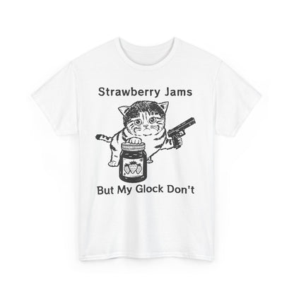 Refined white graphic t-shirt featuring a whimsical design of a cat with a jar of strawberry jam and a handgun, inscribed with 'Strawberry Jams But My Glock Don't.' A stylish addition to any wardrobe.