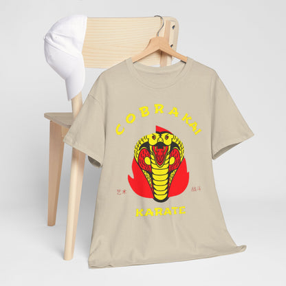 Sophisticated Cobra Kai T-shirt draped over a stylish chair alongside a white cap, highlighting its trendy design and casual luxury.