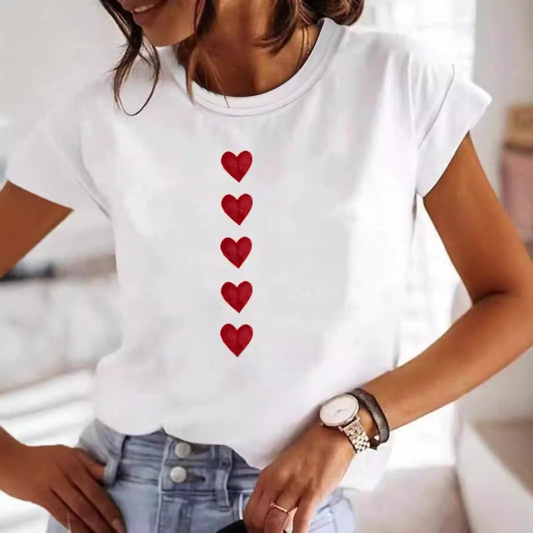 Luxurious Heart Print Plus Size T-Shirt displayed on model, featuring a chic white fabric with a stylish red heart design, perfect for casual street fashion.