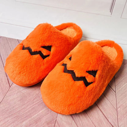 Cute Halloween Pumpkin Slippers Winter Warm Plush Bedroom Floor Home Slippers Casual Slip On Comfortable Cozy Indoor House Shoes featuring an orange plush design with pumpkin face.