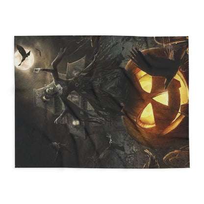 Opulent Halloween-themed Arctic fleece blanket featuring an enchanting witch and a glowing jack-o'-lantern, elegantly displayed flat, ideal for adding seasonal charm to upscale décor.