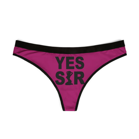 Elegant women's pink thong showcasing a bold 'YES SIR' print, designed for those who embrace confidence and sass in their lingerie collection.
