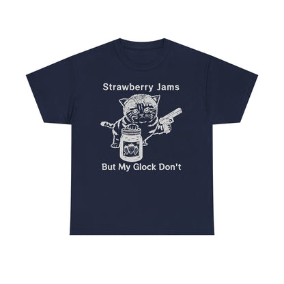 Elegant navy blue graphic tee showcasing a cartoon cat with a jar of strawberry jam and a handgun, accompanied by the phrase 'Strawberry Jams But My Glock Don't.' Ideal for making a bold fashion statement.