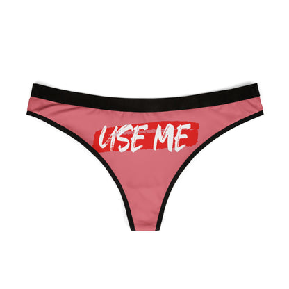 Elegant dusty rose g-string thong featuring bold white lettering 'USE ME', perfect for adding a touch of flirtation to any lingerie collection.
