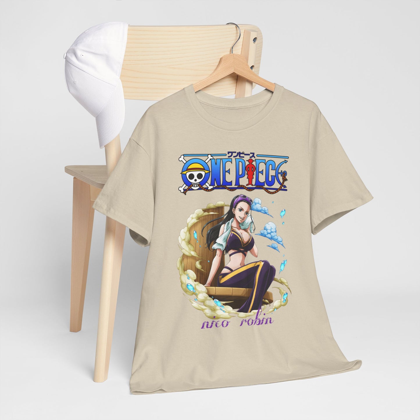 Stylish beige One Piece t-shirt with a captivating illustration of Nico Robin displayed on a wooden chair alongside a fashionable cap, embodying casual elegance.