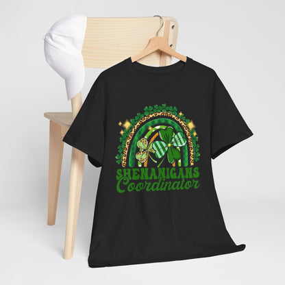 St Patricks Day Unisex Men's Women's Graphic Cotton Funny T Shirt Tee Vintage displayed on a wooden chair with a stylish cap, showcasing a playful 'Shenanigans Coordinator' design perfect for St. Patrick's festivities.