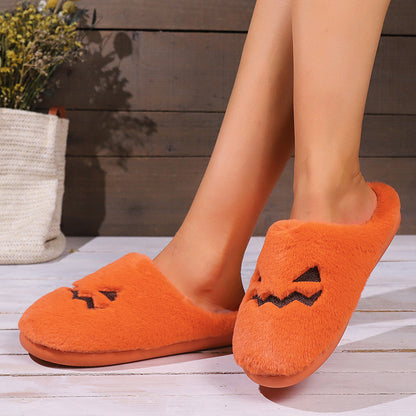Cute Halloween Pumpkin Slippers elegantly presented from a side angle, embodying a blend of comfort and style with its plush texture, ideal for casual home wear this spooky season.