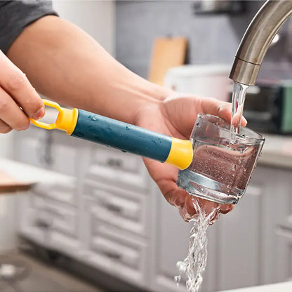 Elegant image of a hand using a versatile vegetable peeler, streamlining the cooking process by effortlessly collecting peelings while washing in the kitchen.