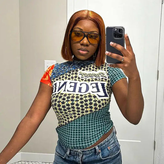 Selfie of a fashionable woman wearing the Sweet Legend Women's Vibrant Print Cropped Tee, highlighting its unique design and luxurious feel.