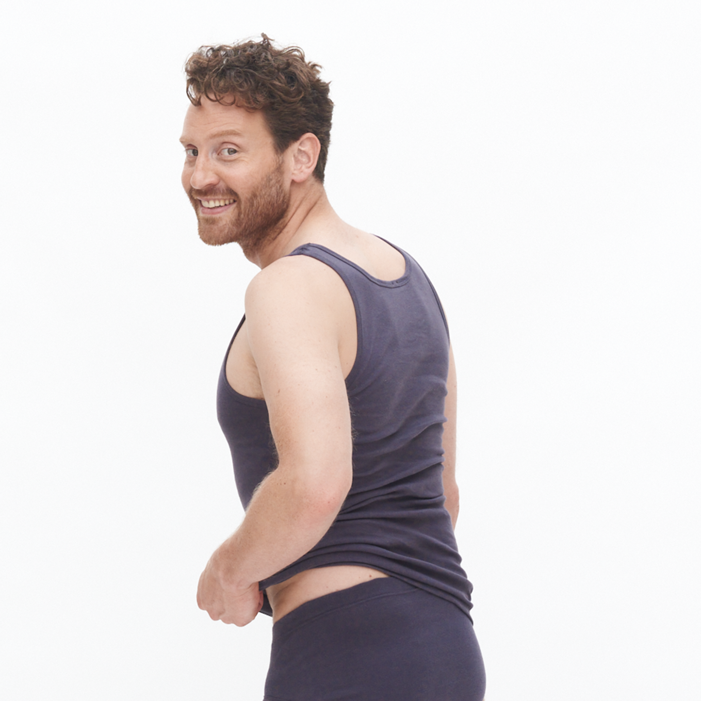 Close-up view of the high-quality organic cotton fabric of the ribbed vest, highlighting its soft texture and sustainable materials.