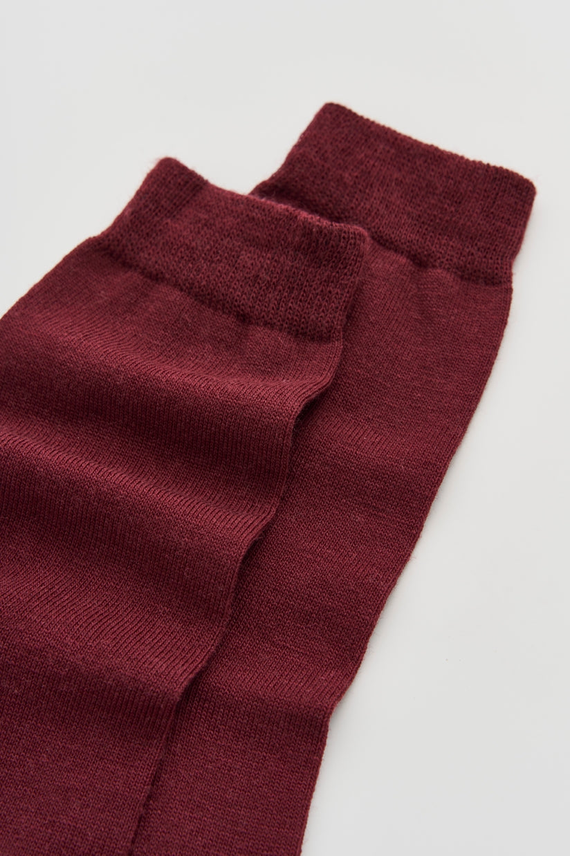 Luxurious Merino wool calf-length socks displayed elegantly in a soft fabric texture, odour-resistant and perfect for everyday wear.