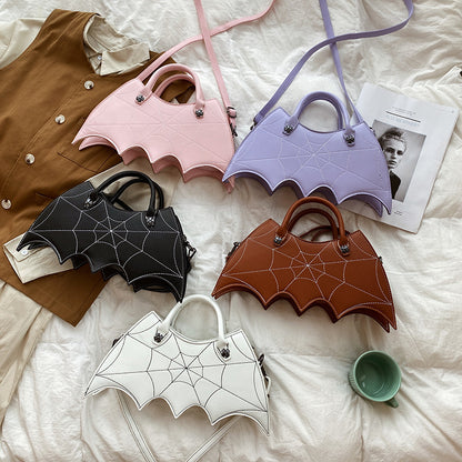 Collection of Halloween Spider Web Shape Shoulder Bags in various colours, demonstrating stylish Batgirl-inspired design, ideal for fashionable seasonal outfits.