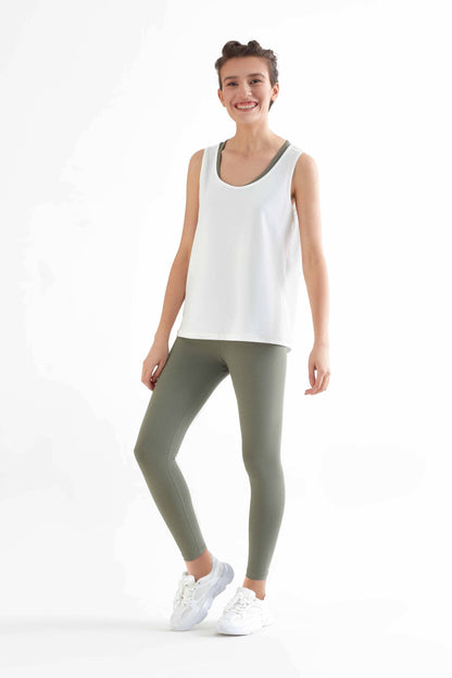 Detail shot of organic cotton and recycled elastane blend used in luxury 7/8 leggings, emphasizing eco-friendly fashion.